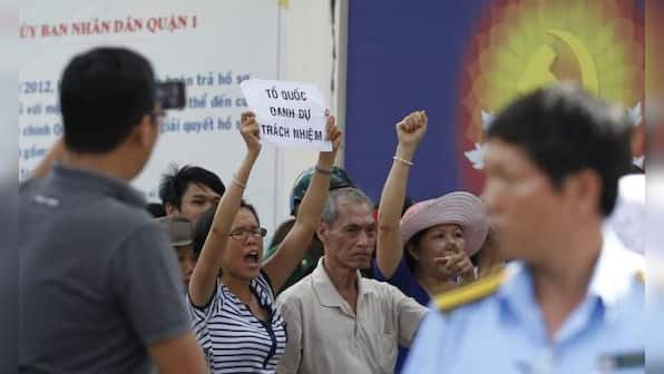 Vietnam stops anti-China protests after deadly riots, China evacuates