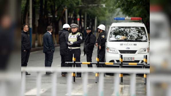 Amid tight security, shoppers return to Xinjiang market after attack