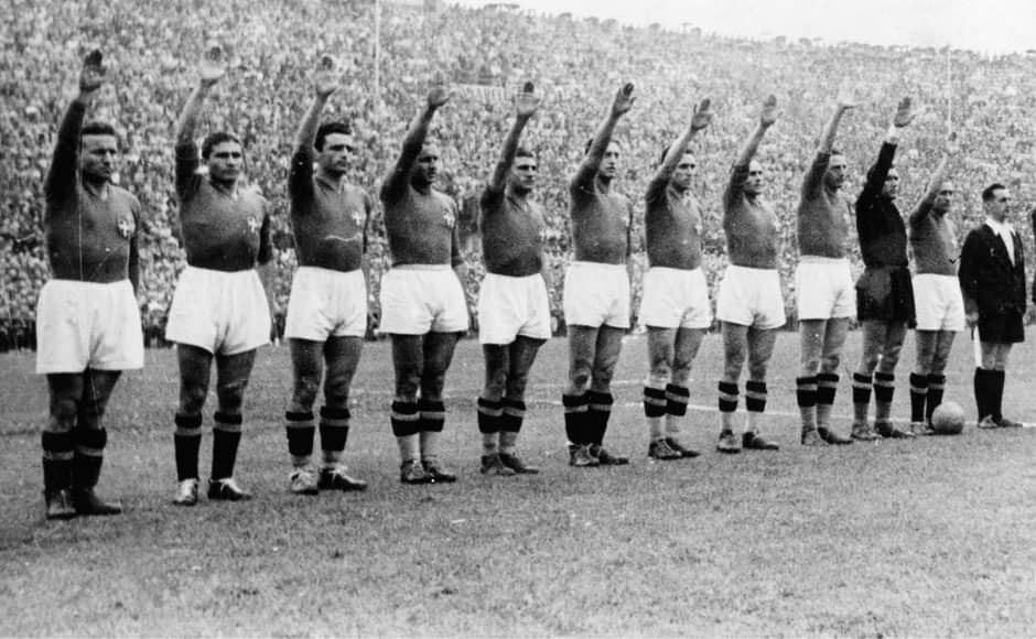  In this June 19, 1938 file photo, Italian soccer team perform the fascist salute before the start of the World Cup soccer final match against Hungary, in Colombes Stadium, Paris, France. On this day: Italy defended its World Cup crown, beating Hungary 4-2. The tournament took place amid the drumbeat of war. AP