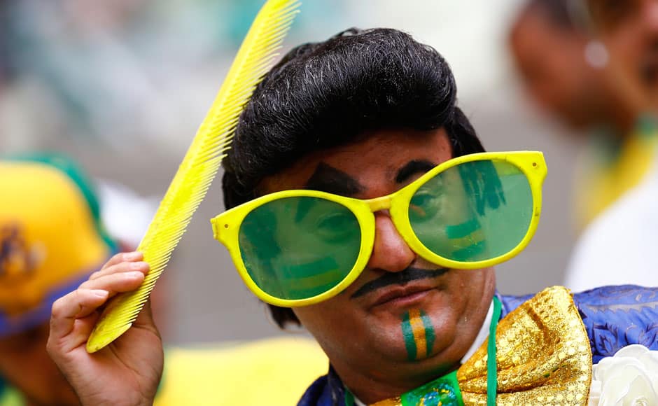 A fan of Brazil poses before their 2014 World Cup Group A soccer match against Mexico at the Castelao arena in Fortaleza June 17, 2014. REUTERS
