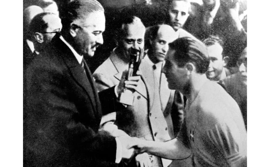 This is a June 18 1938 file photo Italy soccer team captain Giuseppe Meazza receives the Rimet Cup at the end of the soccer World Cup Final, in Colombes Stadium, Paris, France. Italy defeated Hungary by four goals to two in the Final. Meazza regarded by many as the greatest Italian player of all time, Meazza played in two World Cups, and Italy won both. Born and bred in a Milan suburb, the Inter player was 24 when Italy hosted the tournament in 1934. Used on the right wing rather than his favorite center-forward position, the Golden Ball winner unsettled defenses with his dribbles throughout the competition and set up the move that led to Angelo Schiavio’s winner in the final against Czechoslovakia. Four years later in France, he scored just one goal from the penalty spot against Brazil in semifinals, his last under an Italian shirt. AC Milan and Inter decided to rename their San Siro stadium after him following his death in 1979. AP