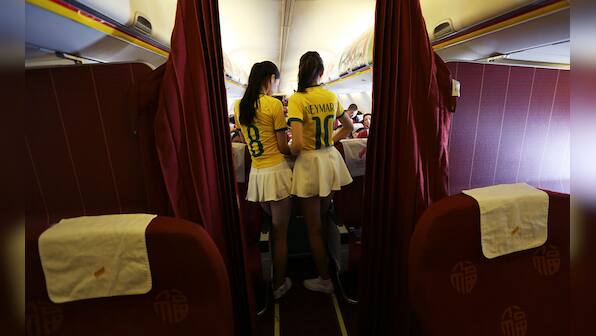Photos: Flight attendants wearing Brazil soccer team jerseys