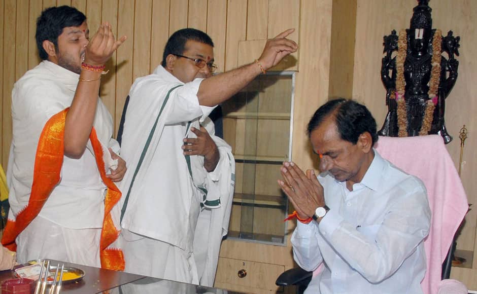 Priests offer blessings to Telangana Chief Minister K Chandrasekhar Rao in his office in Assembly, in Hyderabad on Monday. PTI 