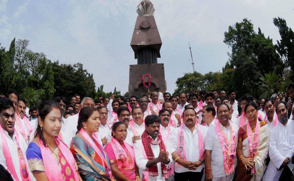 TRS MLAs paying tribute to Telangana martyrs before attending the first session of State Assembly in Hyderabad on Monday. PTI 