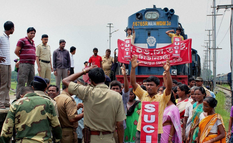 SUCI activists stop the Balurghat-New Jalpaiguri Intercity Express train to protest against the hike rail fare hike at Balurghat Railway station in South Dinajpur district of West Bengal, on Wednesday. PTI