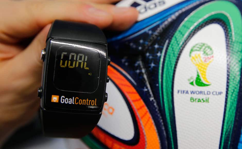 A GoalControl watch is displayed next to an official FIFA 2014 World Cup Brazil football during a demonstration of the goal-line technology in the western German city of Aachen May 28, 2014. German firm GoalControl has been appointed by FIFA as the official provider for the goal-line technology (GLT) at the upcoming soccer World Cup in Brazil. The watch will be worn by referees and will display the word 