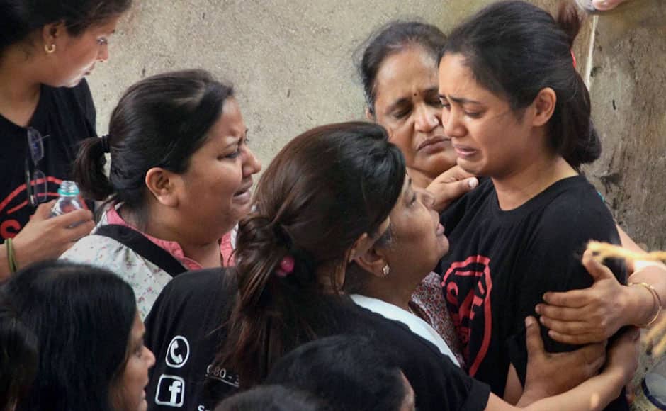 Residents of the Campa Cola society weep after BMC Deputy Commissioner, Anand Waghlarkar warned them of serious repercussions if they continue to create roadblocks in BMC's work in Mumbai on Sunday. PTI