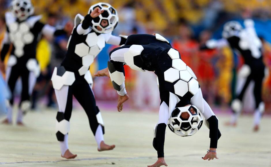 Actors perform during the opening ceremony before the group A World Cup soccer match between Brazil and Croatia, the opening game of the tournament, in the Itaquerao Stadium in Sao Paulo, Brazil, Thursday, June 12, 2014. (AP Photo/Andre Penner)