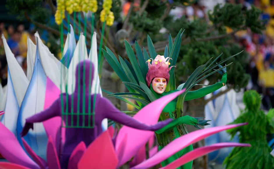 In this photograph taken with a fisheye lens, spectators watch the opening ceremony before the World Cup opening match between Brazil and Croatia at Itaquerao Stadium in Sao Paulo, Brazil, Thursday, June 12, 2014. Thursday is a holiday in Sao Paulo and everybody is celebrating the start of the international soccer tournament. Fans dressed in yellow and green greeted each other, often yelling, 