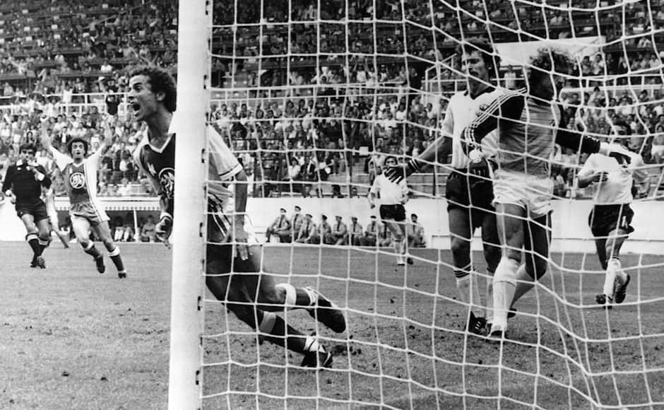  In this June 16, 1982 file photo, Algeria's Lakhdar Belloumi, left, celebrates after scoring the second and winning goal for his team during the World Cup soccer match between Algeria and West Germany in Gijon, Spain. On this day: Algeria beats West Germany 2-1 in one of the great upsets in World Cup history. AP