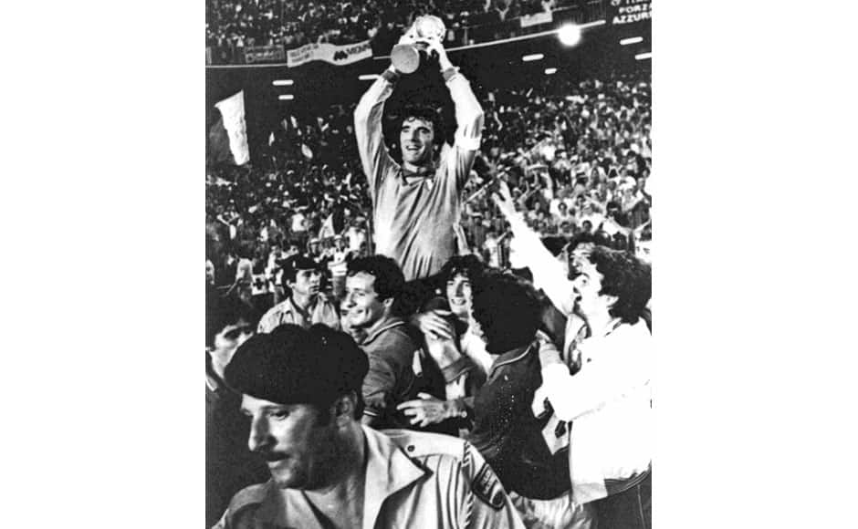 In this July 11, 1982 file photo, Italian team captain and goalkeeper Dino Zoff, is raised aloft by his teammates while holding the World Cup in the Santiago Bernabeu Stadium, in Madrid, after Italy defeated West Germany 3-1 in the World Cup final soccer match. On this day: After a 44 year interval Italy finally wins its third World Cup. AP