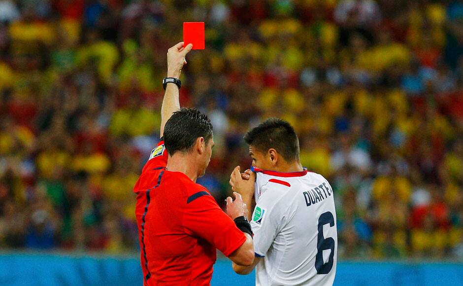 Costa Rica's Oscar Duarte (R) is shown the red card by referee Benjamin Williams of Australia after receiving two yellow cards during their 2014 World Cup round of 16 game against Greece at the Pernambuco arena in Recife June 29, 2014. REUTERS
