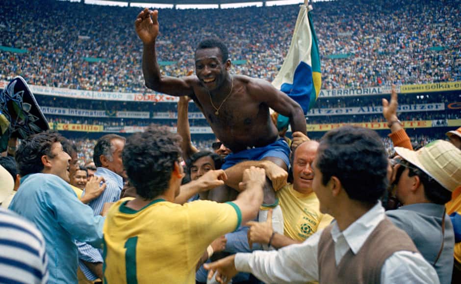 In this June 21, 1970 file photo, Brazil's Pele is hoisted on shoulders of his teammates after Brazil won the World Cup final against Italy, 4-1, in Mexico City's Estadio Azteca. Pele Considered by many the greatest player in football history, Pele won three World Cup titles with Brazil. He was a teenager when he helped the 