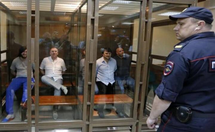 Five jailed for murder of Russian reporter, but son asks: on whose orders?