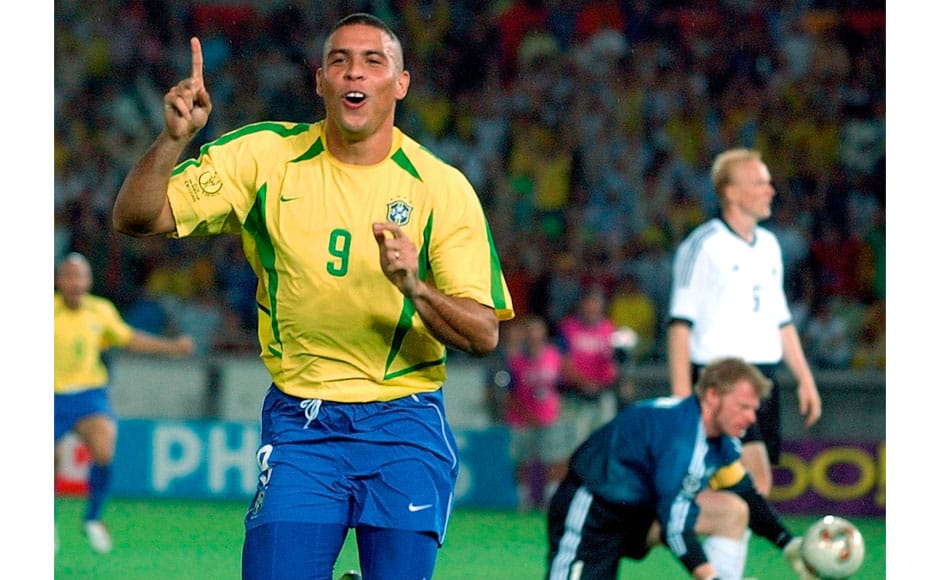 In this June 30, 2002, file photo, Brazil's Ronaldo reacts after scoring past Germany's goalkeeper Oliver Kahn, center, and Carsten Ramelow during the 2002 World Cup final soccer match at the Yokohama stadium in Yokohama, Japan. Ronaldo the striker is the most prolific scorer in World Cups with 15 goals. He was a youngster in the Brazilian squad that won the 1994 World Cup, then helped Brazil reach the final both in 1998 and 2002. He had convulsions the day of the 1998 final in France and didn't play well in Brazil's 3-0 loss to the hosts, but four years in later in South Korea and Japan he scored twice in the final to give Brazil its fifth world title. Ronaldo's last World Cup was in 2006. AP