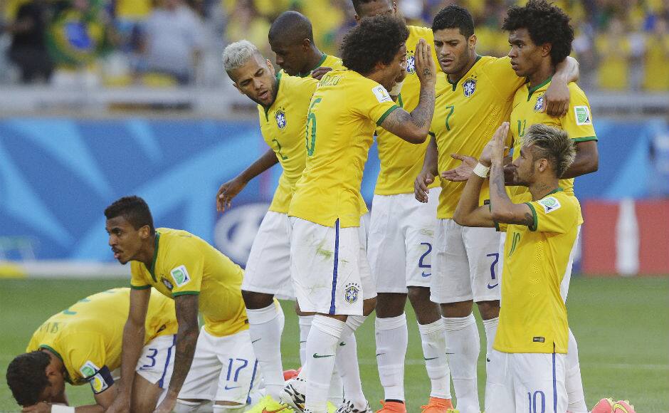 Brazil’s Marcelo celebrates with his teammates after scoring a goal during a penalty shootout following regulation time during the World Cup round of 16 football match between Brazil and Chile. Associated Press 