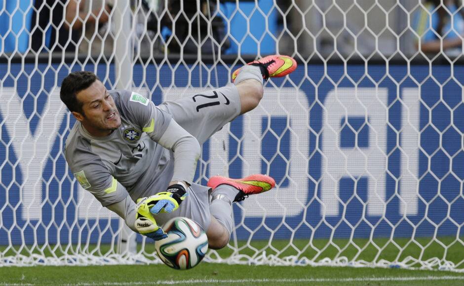 Brazil’s goalkeeper Julio Cesar makes a save during a penalty shootout following regulation time. AP 