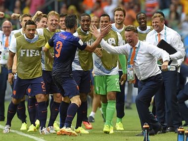 Netherlands' Robin van Persie celebrates with Netherlands' head coach Louis van Gaal after scoring the first goal. AP