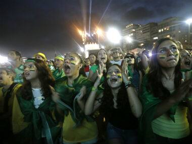 Brazil fans cheer during a world cup match. AP 