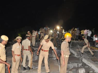 Policemen at the site of Chennai building that collapsed. Firstpost