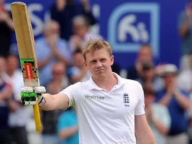 Sam Robson raises his bat after making his first Test century. AP