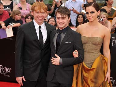 Rupert Grint (left), Daniel Radcliffe (centre) and Emma Watson were some of the stars who attended the ride debut at the theme park. Getty Images