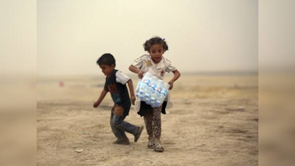 Fight over food marks the beginning of Ramadan for displaced Iraqis ...