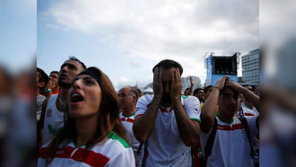 Iran partially opens stadium doors to women and families for male sporting events