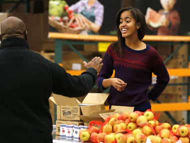 File photo of Malia Obama distributing food. Reuters