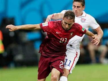 United States' Alejandro Bedoya, right, challenges Portugal's Joao Pereira: AP