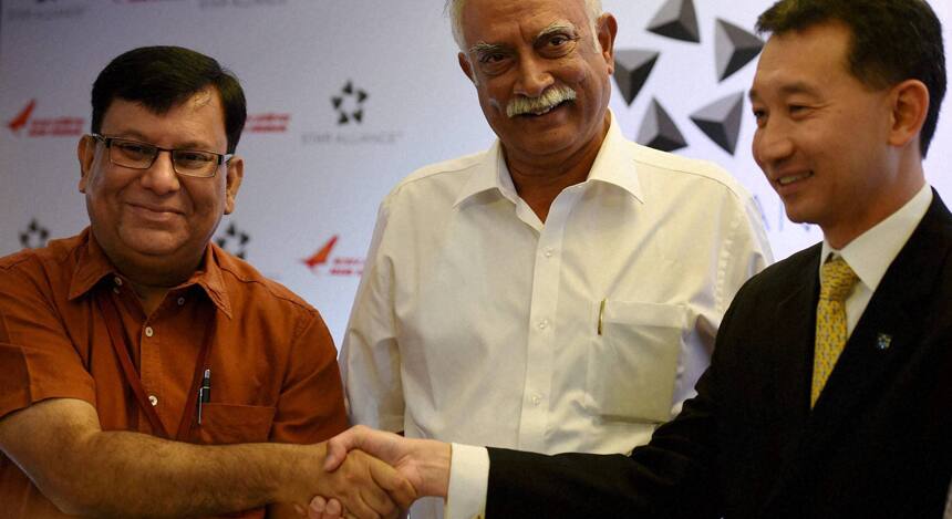 In a significant decision, Air India was inducted into the Star Alliance, an exclusive club of 26 major global airlines, which would enable seamless travel for the airline's passengers to over 1,300 destinations and may increase its revenues by five percent. Passengers will enjoy benefits from 11 July, when the airline finally joins the grouping formally, an alliance spokesperson said. Here, Civil Aviation Minister Ashok Gajapathi Raju looks on as Air India CMD Rohit Nandan and Star Alliance COO Jeffrey Goh shake hands during the announcement of Air India's joining of Star Alliance. PTI Photo