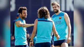 Pique lets cat out of the bag, says Fabregas 'is leaving' Barca