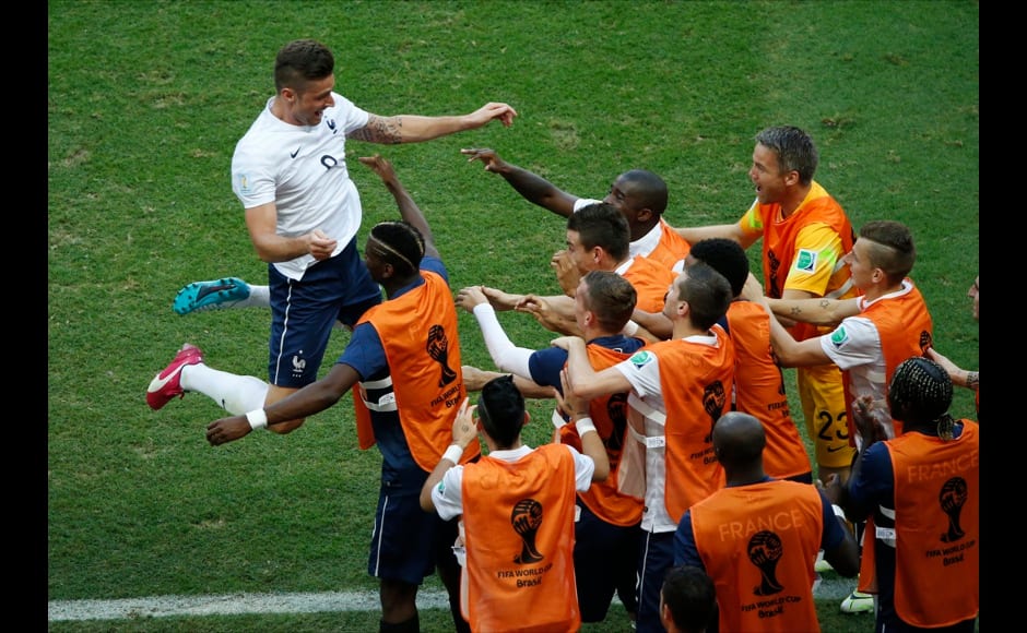 France's Olivier Giroud celebrates with his teammates after scoring a goal during their 2014 World Cup Group E soccer match against Switzerland at the Fonte Nova arena in Salvador June 20, 2014. REUTERS