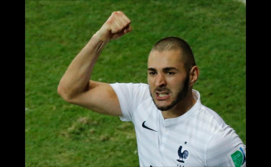 France's Karim Benzema celebrates after scoring a goal with his teammates. It was his third goal of the tournament. Reuters