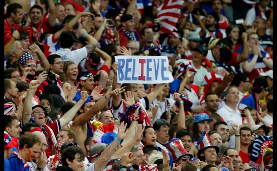 Fans of the U.S. cheer their team on during their 2014 World Cup Group G soccer match against Portugal at the Amazonia arena in Manaus June 22, 2014. REUTERS