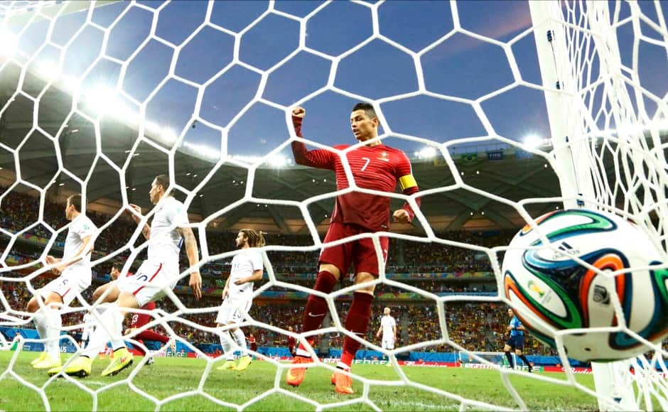 Portugal's Cristiano Ronaldo (R) celebrates a goal against the U.S. by teammate Nani (unseen) during their 2014 World Cup Group G soccer match at the Amazonia arena in Manaus June 22, 2014. REUTERS