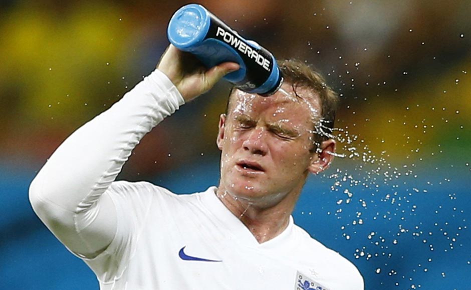 Rooney cools off during the game against Italy. The heat in Manaus seemed to be taking its toll on the players. Reuters
