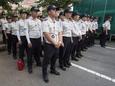 South Korean police stand guard in front of the Gwangju District Court building during the trial of the ferry's crew members. AFP image