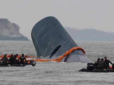 File photo of Coast Guard officials around the sunken ferry. AP