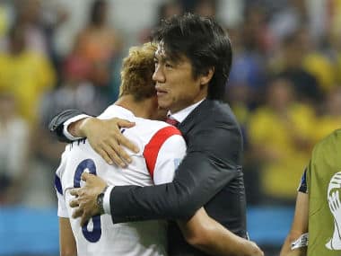 South Korea head coach Hong Myung-bo, right, comforts his player Son Heung-min, left, after the group H World Cup soccer match between South Korea and Belgium. AP 