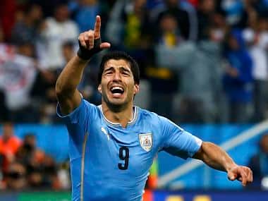 Luis Suarez celebrates after scoring his 2nd goal against England. Reuters