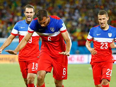 John Brooks of the U.S. (C) celebrates his goal against Ghana next to teammates Graham Zuisi (L) and Fabian Johnson. Reuters