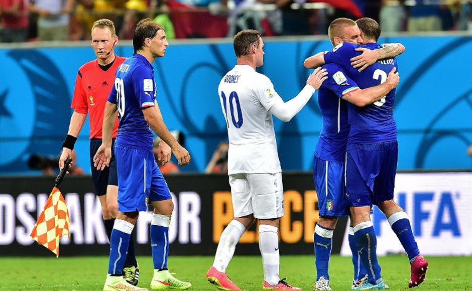 Wayne Rooney congratulates the Italian players after the final whistle. All, in all, it was an entertaining game and Italy held their nerves to win it 2-1. AFP