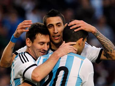 Argentina's Lionel Messi (L) embraces team mates Angel Di Maria (C) and Sergio Aguero after he scored his team's second goal during their international friendly soccer match against Slovenia ahead of the 2014 World Cup. Reuters