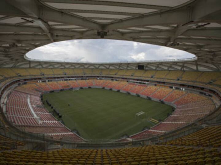 Grounds crew uses green dye to maintain stadium for England-Italy game