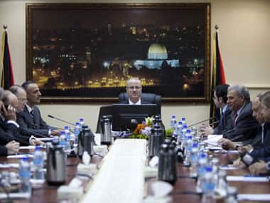Palestinian Prime Minister Rami Hamdallah (centre) attends his first meeting of the Palestinian unity government cabinet.