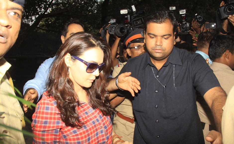 Preity Zinta , who wore a red-and-blue flannel shirt and black pants was escorted inside the Wankhede Stadium by cops. 