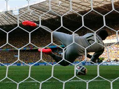Brazil's goalkeeper Julio Cesar makes a save after Chile's Alexis Sanchez shot from the penalty spot. AP