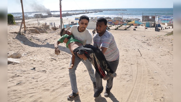 Photos: Israeli strikes leave four children dead on Gaza beach