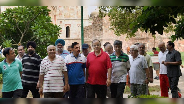 Photos: Finance Minister budgets in a break, goes on Sunday power walk